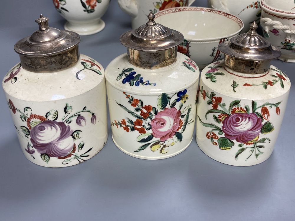A collection of nine pieces of late 18th century creamware, including bullet-shaped teapot, 11cm high and four tea canisters with silve